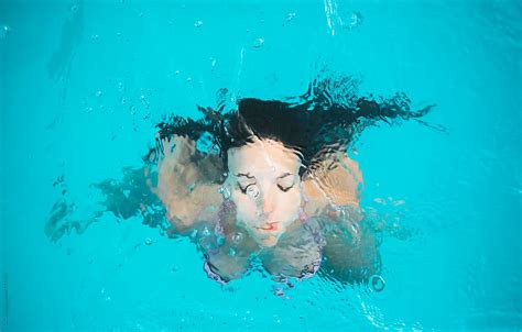 Turquoise pool. . Naked women swimming